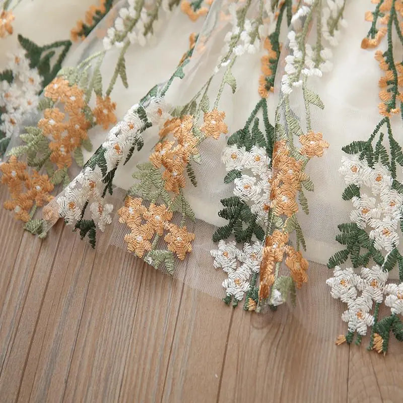 949828 - Toddler Girl Embroidery Mesh Hem Dress Cadiz Boutique, Inc.