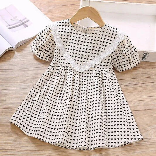 955054 - Toddler Girl Heart-shaped Print Lace Trim Dress Cadiz Boutique, Inc.